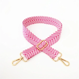 Pink and white woven herringbone bag strap with adjustable gold metal hardware