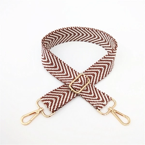 Adjustable brown and white woven shoulder strap with gold metal buckles for handbags