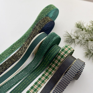 Various Christmas green and gold ribbons for DIY gift wrapping and festive decoration