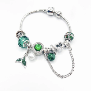 Silver snake chain bracelet with green fish tail charms and pearl in ocean theme