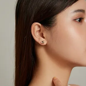 Minimalist S925 silver bee stud earrings with gold plating and enamel on female model