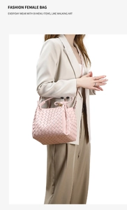 Detail showing pink woven leather bag texture and metal buckle on shoulder strap
