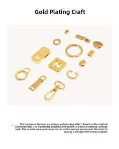 Detailed view of vintage gold-plated hardware including lobster clasps and metal buckles