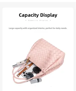 Spacious interior of pink woven tote bag holding phone, sunglasses, and perfume