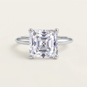 Princess cut moissanite ring with four-prong setting in polished white gold finish
