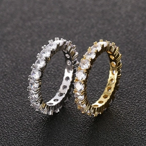 Macro shot of gold and silver eternity rings with round cut cubic zirconia stones