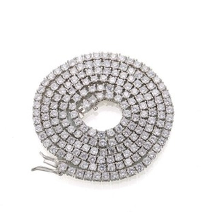 Close-up of silver-tone tennis chain with pavé-set round cubic zirconia stones