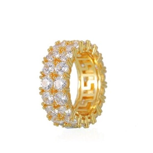 Detail view of gold hip hop ring with double row zircon and Greca pattern