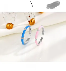 Macro detail of S925 sterling silver rings with colorful enamel and white zircon stones