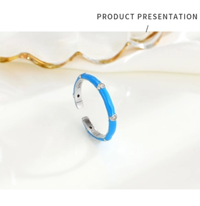 Macro view of adjustable S925 silver ring with blue enamel and sparkling zircon stones