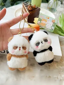 Pair of magnetic panda plush keychains in black-white and brown-white with gold chains