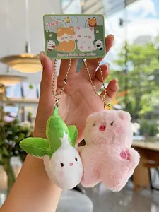 Detail of plush bear and rabbit couple pendants with soft texture and ball chain
