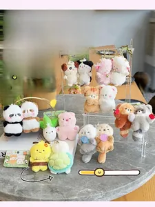 Close-up of mini magnetic plush animal charms with metal chains in diverse animal designs