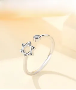 Detail of s925 sterling silver hexagon star ring with cubic zirconia and polished finish