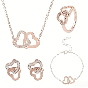Parure de bijoux double cœur en or rose avec collier boucles d'oreilles bracelet et bague