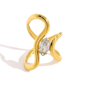 Macro shot of gold stainless steel ring featuring a marquise-cut zircon in curved design