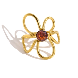 Artistic gold flower ring with red zircon center and hollow minimalist design