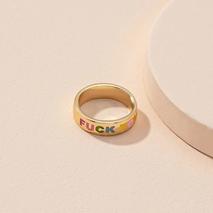 Golden band ring with colorful Fuck You slogan engraving and smooth polished finish