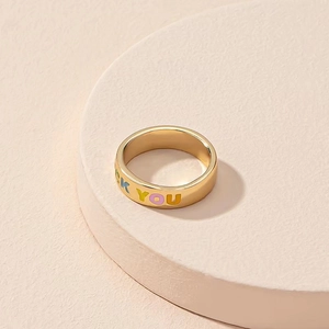 Golden plated brass ring featuring colorful FUCK YOU enamel lettering in streetwear style