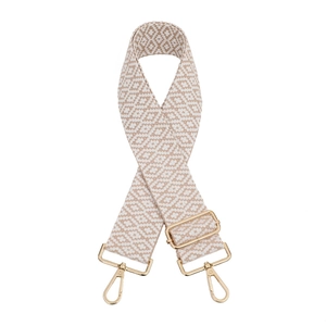 Close-up of geometric woven bag strap in beige and white with gold metal lobster clasps