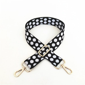 Adjustable shoulder strap for bags with classic black and white polka dots and gold hardware