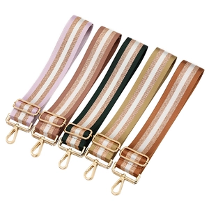 Adjustable colorful striped woven bag straps with gold metal hardware in five vibrant colors