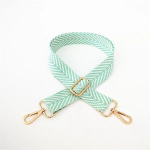 Adjustable mint green and white woven chevron bag strap with gold metal hardware