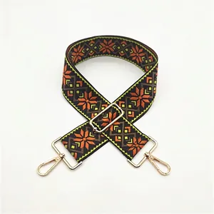 Adjustable ethnic style woven bag strap with orange and green floral geometric pattern
