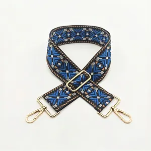 Ethnic blue and black woven bag strap with geometric patterns and gold metal buckles