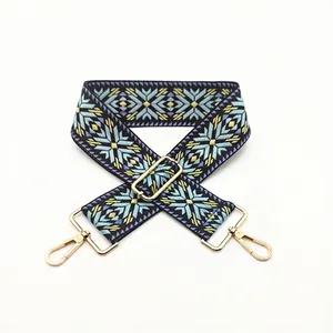 Ethnic blue and yellow geometric woven shoulder strap with adjustable gold metal buckles