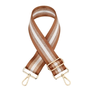 Detail of adjustable woven shoulder strap with gold thread and metallic lobster clasps