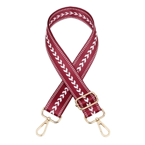 Adjustable burgundy woven bag strap with white V-pattern and gold metal lobster clips