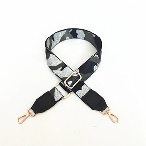 Adjustable camouflage bag strap with silver metallic weaving and gold-tone metal hooks