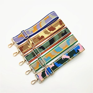 Five assorted wide camouflage canvas bag straps with adjustable gold metal hardware