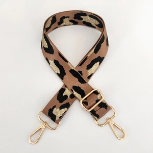 Adjustable leopard print bag strap with golden metallic thread and lobster clasps