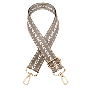 Adjustable khaki jacquard bag strap with white arrow pattern and gold metal hooks