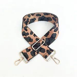 Adjustable leopard print bag strap with polished gold hardware and clip-on hooks
