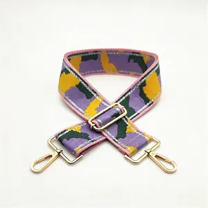 Adjustable camouflage strap for bags with purple-yellow pattern and gold metal hooks