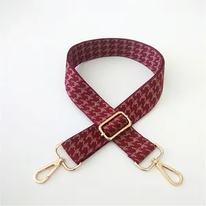 Adjustable burgundy houndstooth strap with golden metal swivel lobster clasps