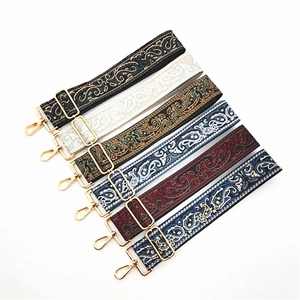 Ethnic paisley adjustable bag straps with golden metal hooks in six colors shown on white