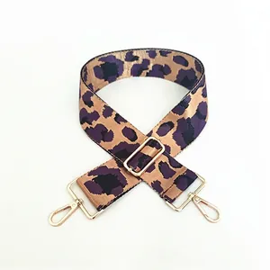 Detail view of the purple leopard pattern woven strap with gold metal spring hooks