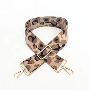 Close-up of leopard print wide replacement strap with gold metal lobster clasps