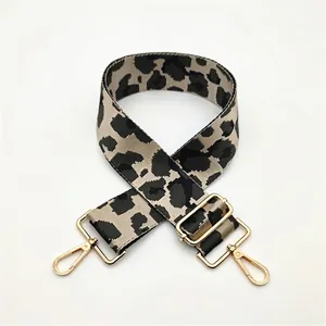 Detail of leopard print wide strap with high-density nylon and gold metal hooks