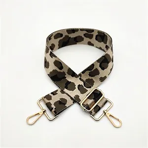 Detail of leopard print wide strap with adjustable golden alloy hardware for handbags