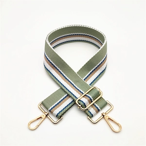 Adjustable green striped woven bag strap with golden metal swivel hooks and buckles