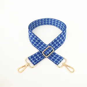 Detail of blue houndstooth replacement strap with adjustable golden metal hardware