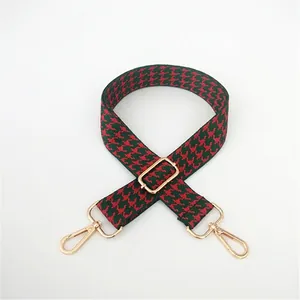 Adjustable red and green houndstooth strap with golden metal lobster clasps for handbags