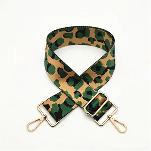 Adjustable wide leopard print shoulder strap with gold metal buckles in green tones