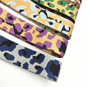 Macro shot of durable leopard print straps in four vibrant colors for crossbody bags