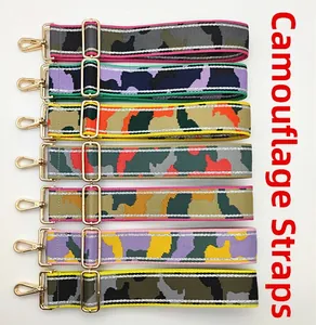 Detail view of 7 camouflage bag straps with gold metal hooks and adjustable buckles